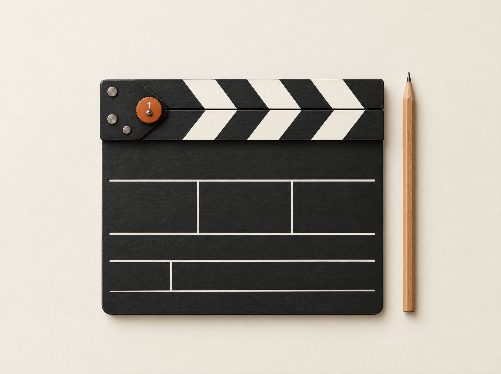 A black-and-white film clapperboard lying flat on ivory paper, its take dial set to one in burnt orange, a pencil beside it